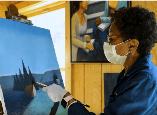 Paula Cleggett doing painting